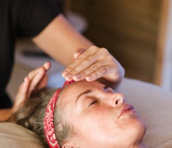 Relaxed woman getting alternative massage
